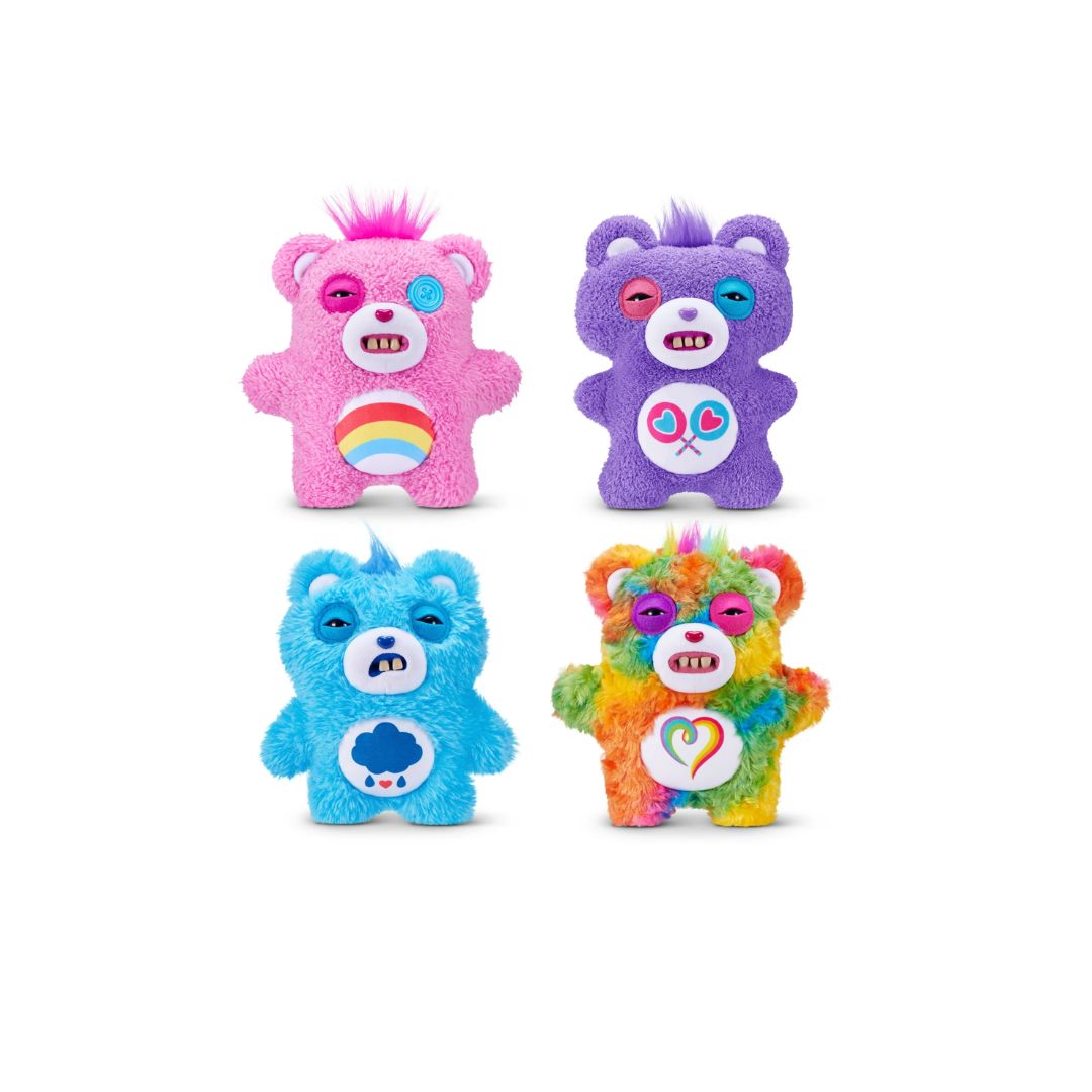 Four colorful Care Bears plush bag charms shown together on a white background—a pink bear with a rainbow belly, a purple bear with heart and key symbols, a blue bear with a storm cloud belly, and a multicolored tie‑dye bear with a heart emblem.