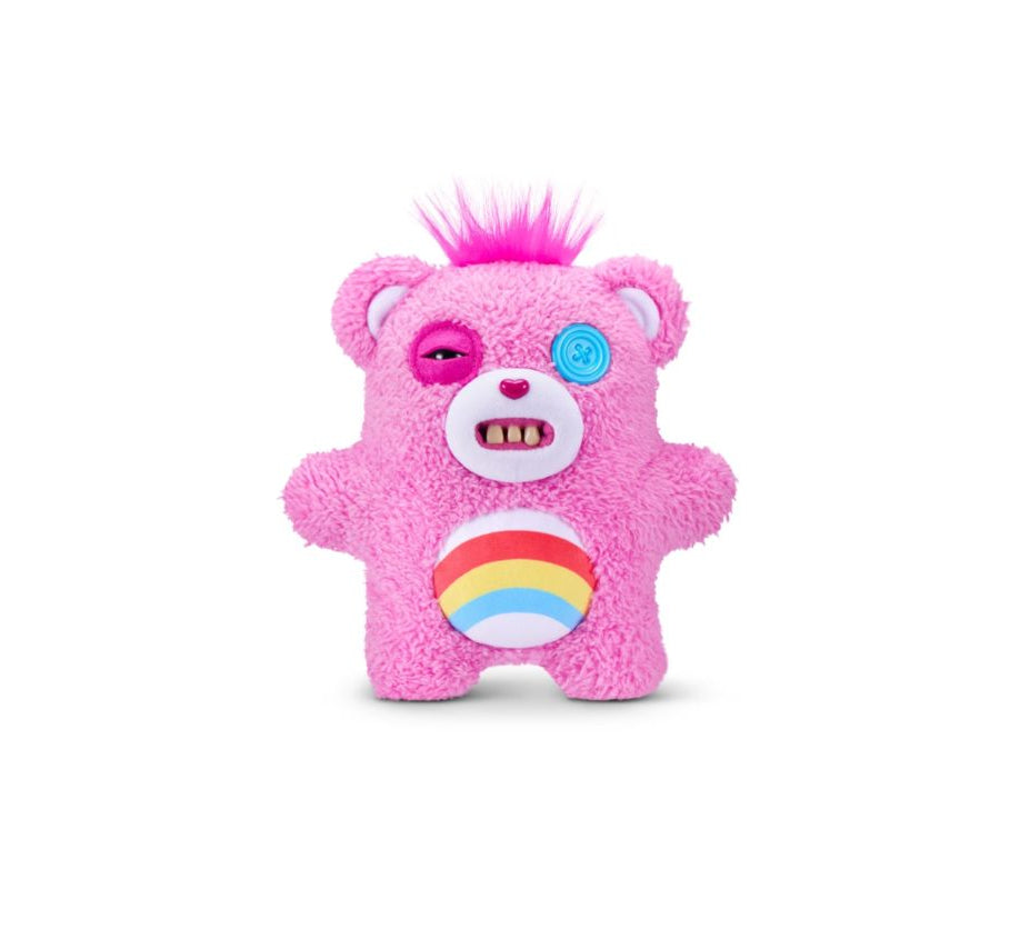 Pink Care Bears plush bag charm with a textured fuzzy body, a rainbow belly emblem, a blue button eye, and a small tuft of bright pink hair on top, shown on a white background.