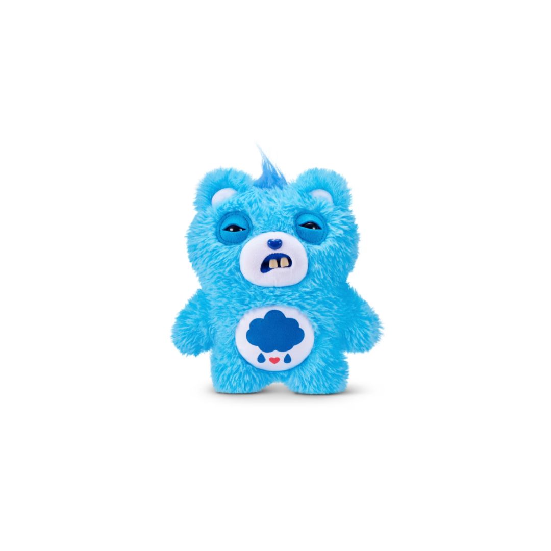 Blue Care Bears plush bag charm with a fuzzy textured body, a white belly emblem showing a dark blue storm cloud with small hearts below, half‑closed eyes, small white teeth, and a short tuft of blue hair on top, shown on a white background.