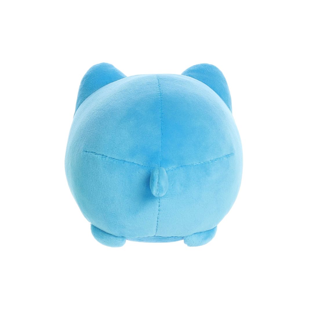 Back view of a small blue plush toy shaped like a round cat, with two pointed ears, a short tail seam at the center, and small rounded feet, shown on a white background.