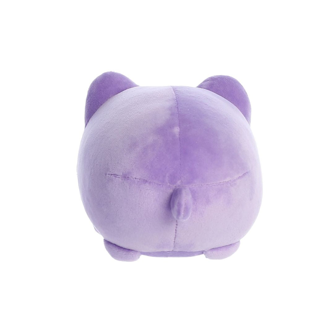Back view of a small purple plush toy shaped like a round cat, with two pointed ears, a short stitched tail at the center, and small rounded feet, shown on a white background.