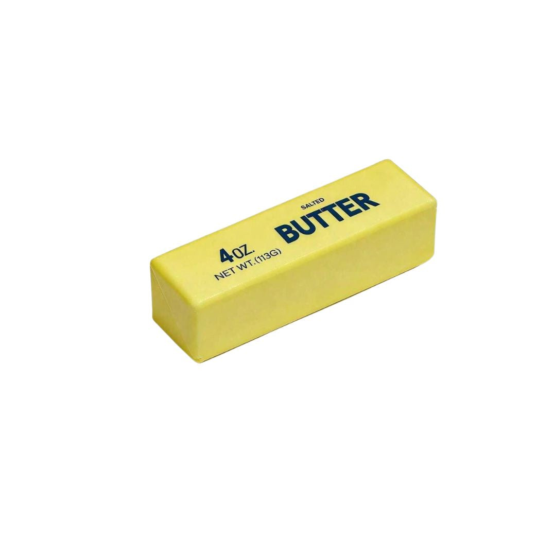 Yellow butter‑shaped squishy toy labeled ‘4 oz. Salted Butter’ displayed alone on a white background