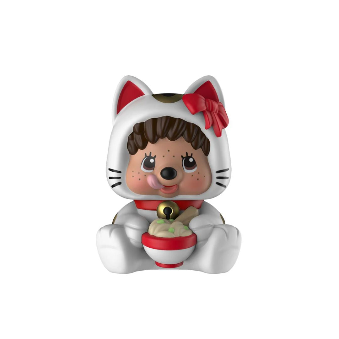 Toy figure of a girl with cat ears and a red bow, holding a bowl on a white background