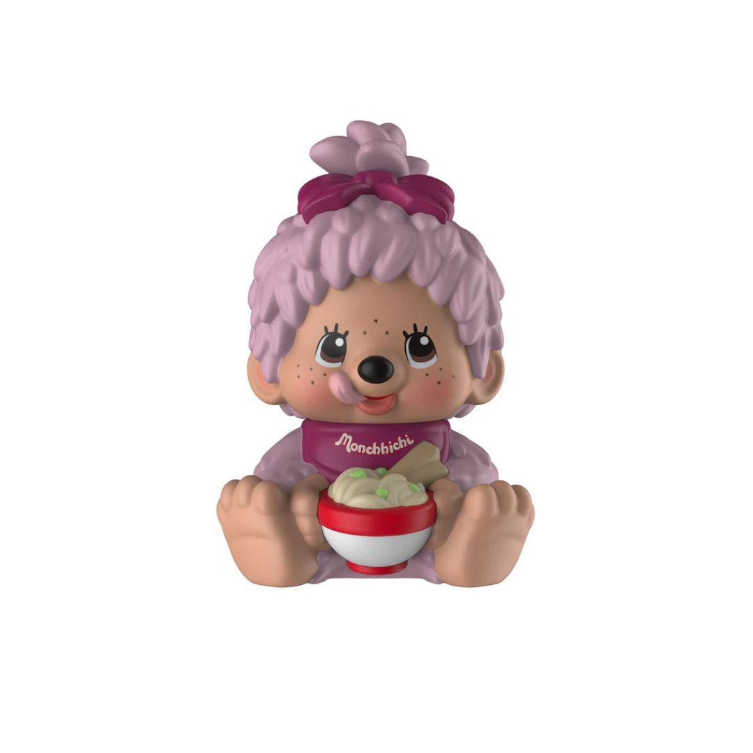 Toy figure with pink hair and a pink bow, holding a bowl, on a white background