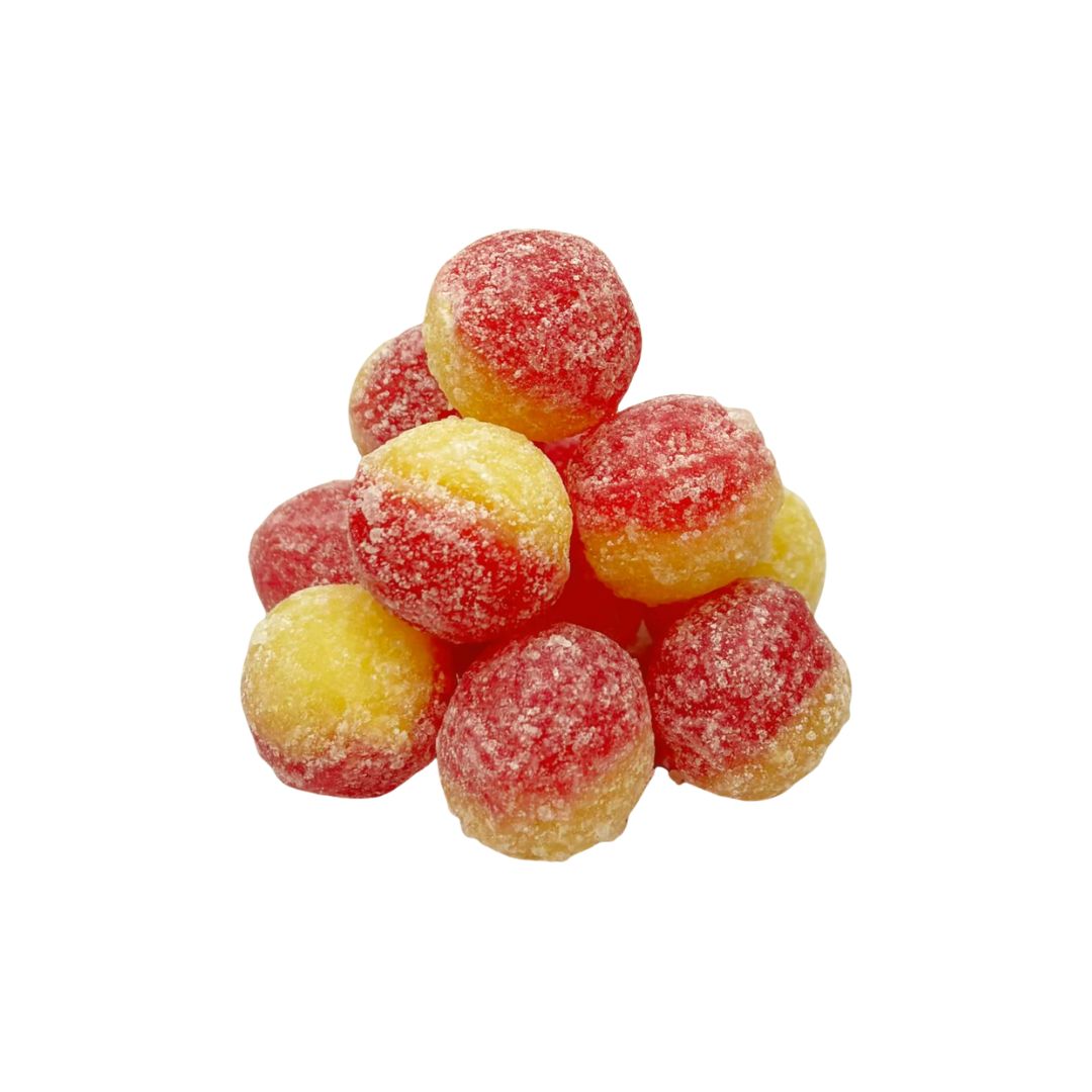Cluster of red and yellow rancid custard ultra sours on a white background