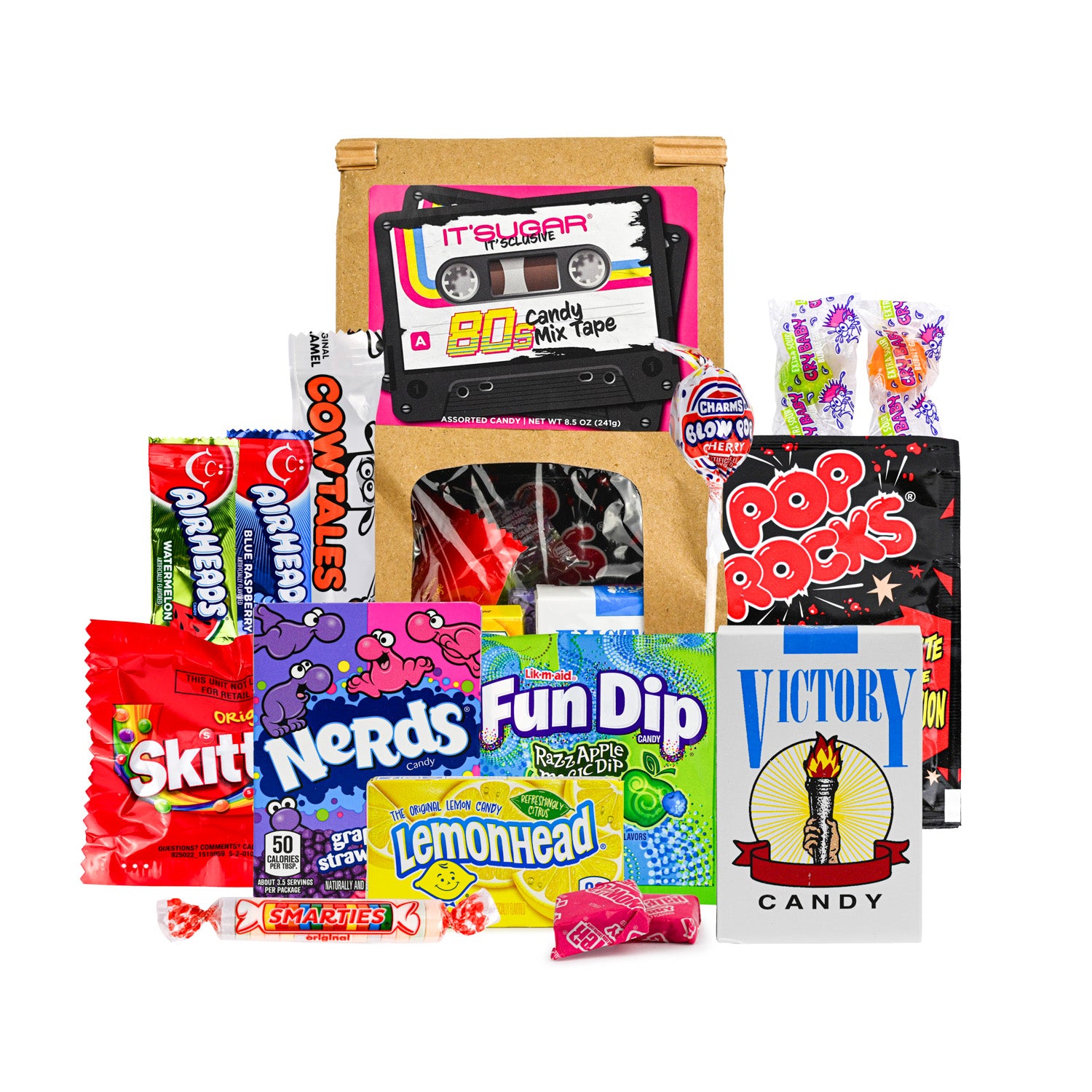 Assorted 1980s‑themed candy gift set featuring a brown “It’Sugar 80s Candy Mix Tape” bag filled with nostalgic candies, including Skittles, Nerds, Fun Dip, Lemonhead, Airheads, Pop Rocks, Smarties, and Victory Candy, arranged in front on a white background