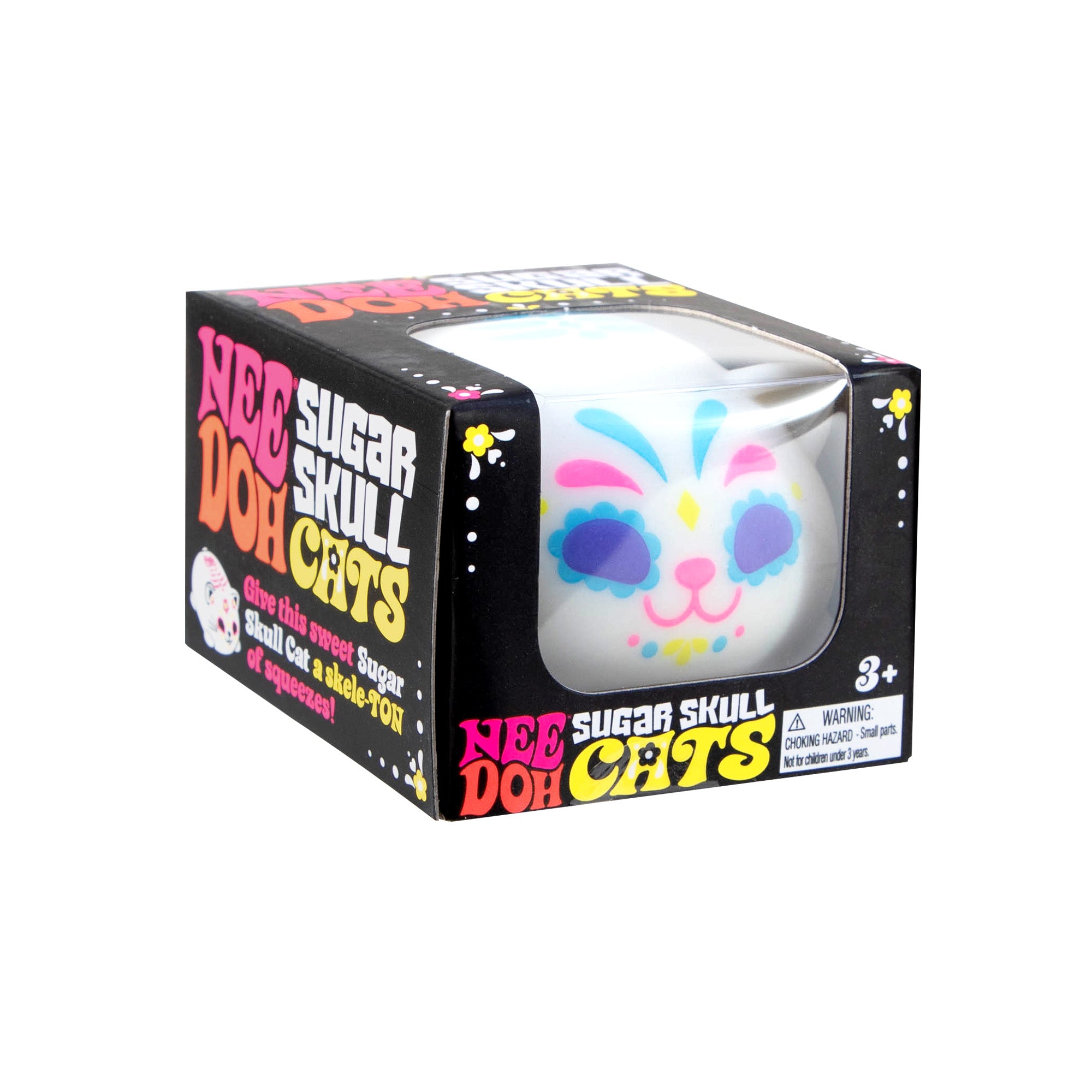 Boxed product labeled “Nee Doh Sugar Skull Cats” showing a cube‑shaped squeeze toy with a colorful sugar skull cat face visible through a clear window.