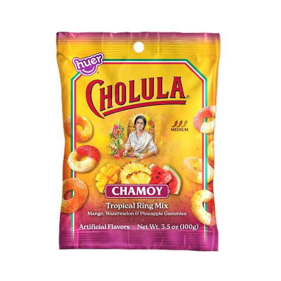 A 3.5 oz bag of Cholula Chamoy Tropical Ring Mix gummies, featuring a bright yellow and magenta packaging design with illustrations of colorful ring-shaped gummies and fruit imagery.