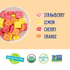 Assorted colorful chewys in a bowl with flavor labels on a beige background.