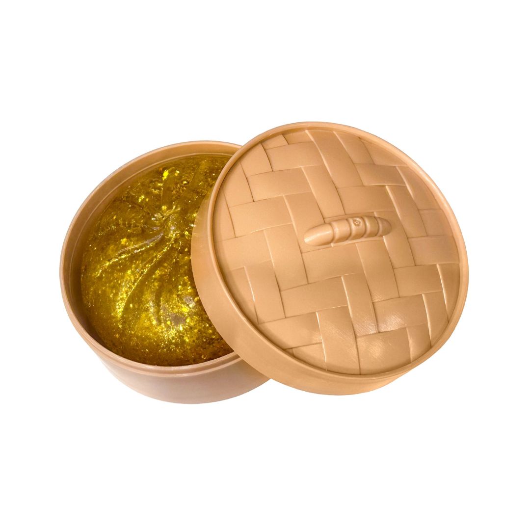 Tan Dumplin container with a gold sparkle dumplin inside