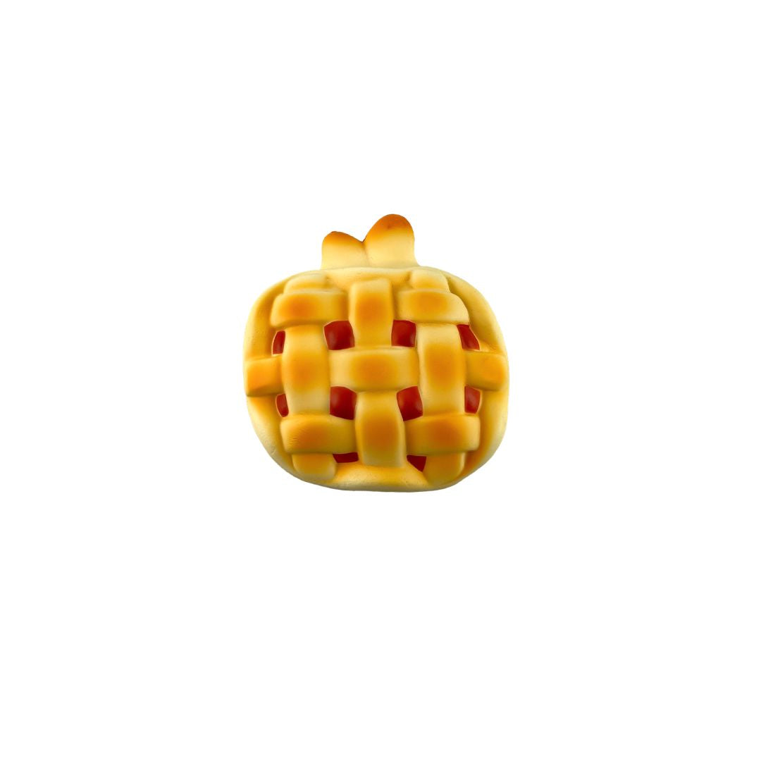 Lattice-topped mini pie with a golden crust and red filling on a white background.