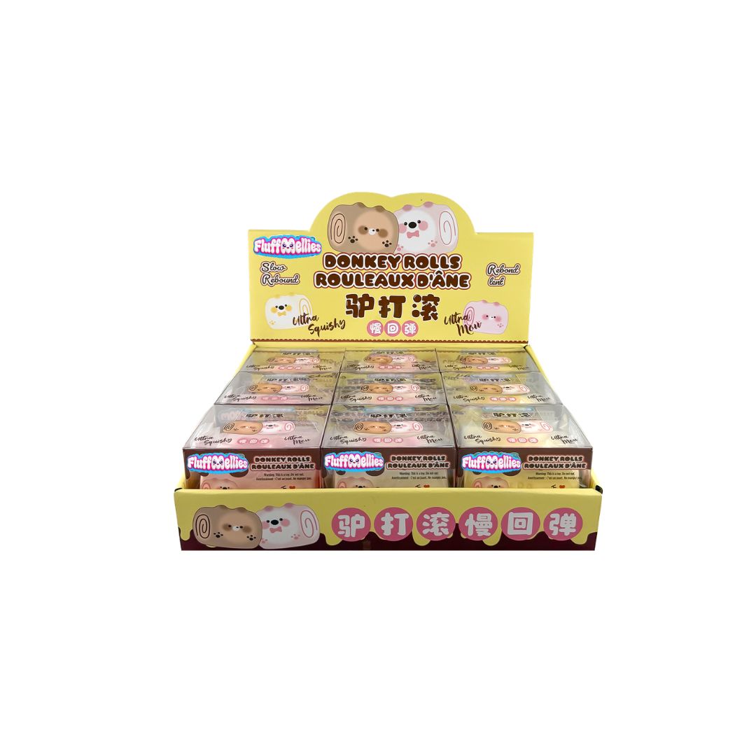 Counter display tray with multiple boxed Fluffiemellies Donkey Rolls squishy toys in yellow and brown packaging.