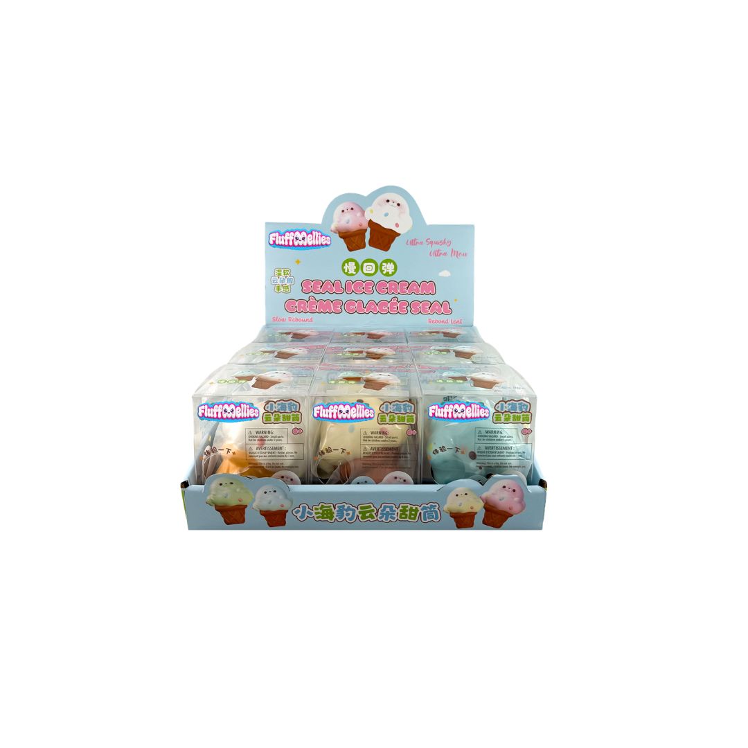 Counter display tray with multiple boxed Fluffiemellies Seal Ice Cream squishy toys featuring seal characters and light blue and pink packaging