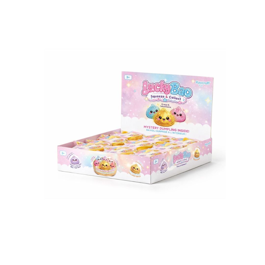 Open display box of “Lucky Bao Squeeze & Collect” toys, showing multiple pastel‑colored dumpling‑shaped squishy toys packaged in individual round containers, with a pink and purple display header featuring cartoon dumpling characters and product branding on a white background.