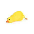 Side view of a large yellow duck‑shaped squishy toy lying flat, with an orange beak, small black eyes, and orange feet extending behind, shown on a white background.