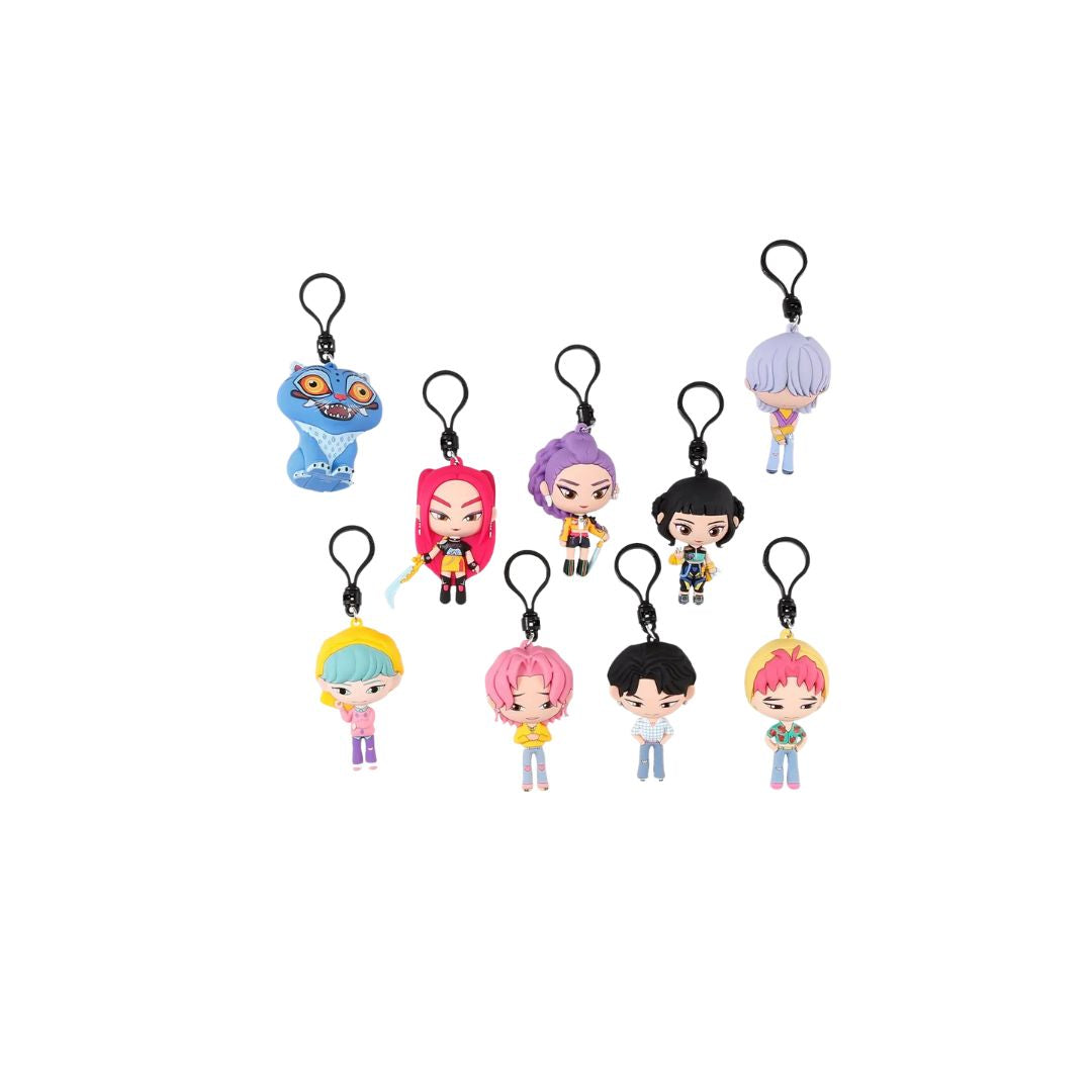  Assorted K‑Pop Demon Hunters character bag‑clip keychains displayed on a white background, each showing a small stylized figurine attached to a black clip, arranged in rows with different hairstyles, outfits, and colors.
