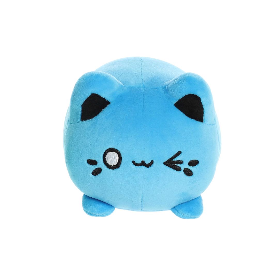 Front view of a small blue plush toy shaped like a round cat, with black ears, embroidered eyes, whisker markings, and short legs, shown on a white background.