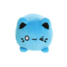 Front view of a small blue plush toy shaped like a round cat, with black ears, embroidered eyes, whisker markings, and short legs, shown on a white background.