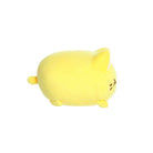 Side view of a small yellow plush toy shaped like a rounded cat, with short legs, a tiny tail, white inner ears, and minimal embroidered facial details, shown on a white background.
