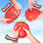 Red squishy toy shaped like a strawberry with text labels 'Stretch!', 'Poke!', and 'Squeeze!' on a blue background.