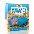 A box of Oasis Treasures Dubai Chewy Dumpling Cotton Candy, featuring a blue dumpling with a cute face and a cut-open dumpling showing pink cotton candy filling, set against a bamboo-style background.