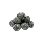 Cluster of dark gray black death sour balls on a white background
