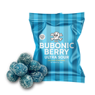 A blue striped bag of 'The Bubonic Berry Ultra Sour' candy with a pile of blue, sugar-coated sour candies in the foreground, set against a plain white background.