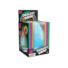 A boxed needoh toy product labeled 'Dream Drop' shown on a plain white background. The package is black with bright rainbow graphics and a clear front window revealing a blue, textured, egg-shaped toy inside.