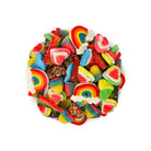Assorted colorful gummy candies including rainbows and hearts on a white background