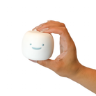 et-Puffed scented squishy toy featuring a white marshmallow-shaped character with a smiling face in a female hand