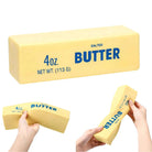 Block of butter squishy toy with packaging held by hands on a white background