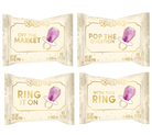 Four RingPop candy packages arranged in a 2x2 grid on a white background. The packages are cream-colored with gold lettering and a purple ring-shaped candy illustration.