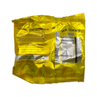 A crinkled metallic gold bag of Mr. Simms Yellow Fever Ultra Sour hard boiled candies, showing the back and side of the packaging with product details and nutrition facts.