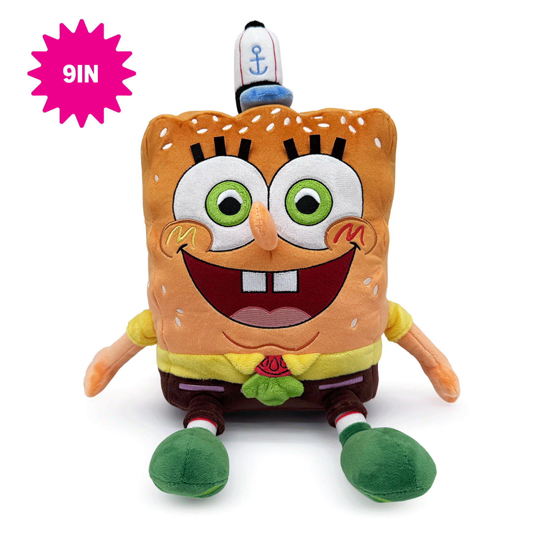 A SpongeBob-Youtooz plush toy shaped like a square bread character with large green eyes, a wide smile, yellow shirt, brown pants, and green shoes, shown on a white background with a pink '9IN' badge in the top left corner.