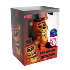 YouTooz Toy Freddy vinyl figure in its original retail packaging, featuring a collectible orange-brown bear character with a black top hat and bow tie, shown on a white background.