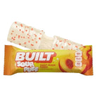 Sour Sweet Peach Puff candy bar with packaging on a white background
